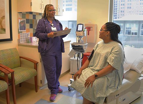 healthcare professional talking to patient