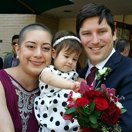 Monica Garcia Norlander with her husband and child
