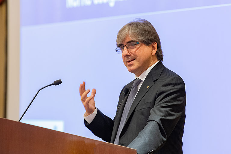 Dr. Platanias speaks at a podium