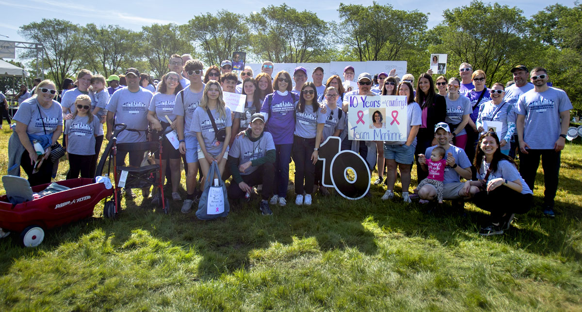 a large family poses at the Cancer Survivors' Celebration Walk & 5K in Grant Park, Chicago.