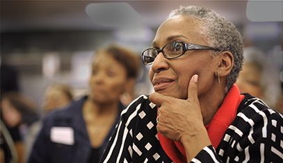 Attendee listening to a presentation