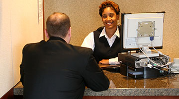 Staff with patient at desk