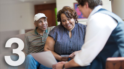 Patients talking to staff member
