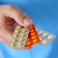 hand holding pill packs