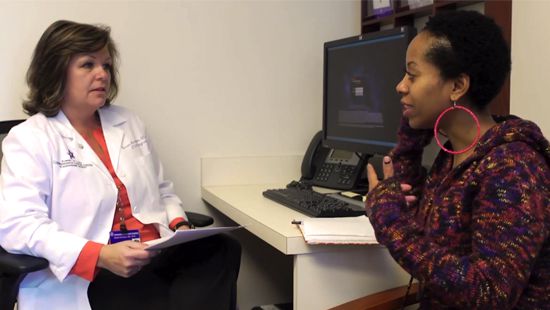 Cancer Survivor consults with healthcare professional