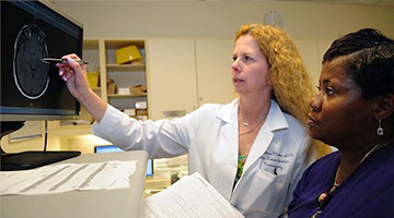 Healthcare professional looking at computer screen